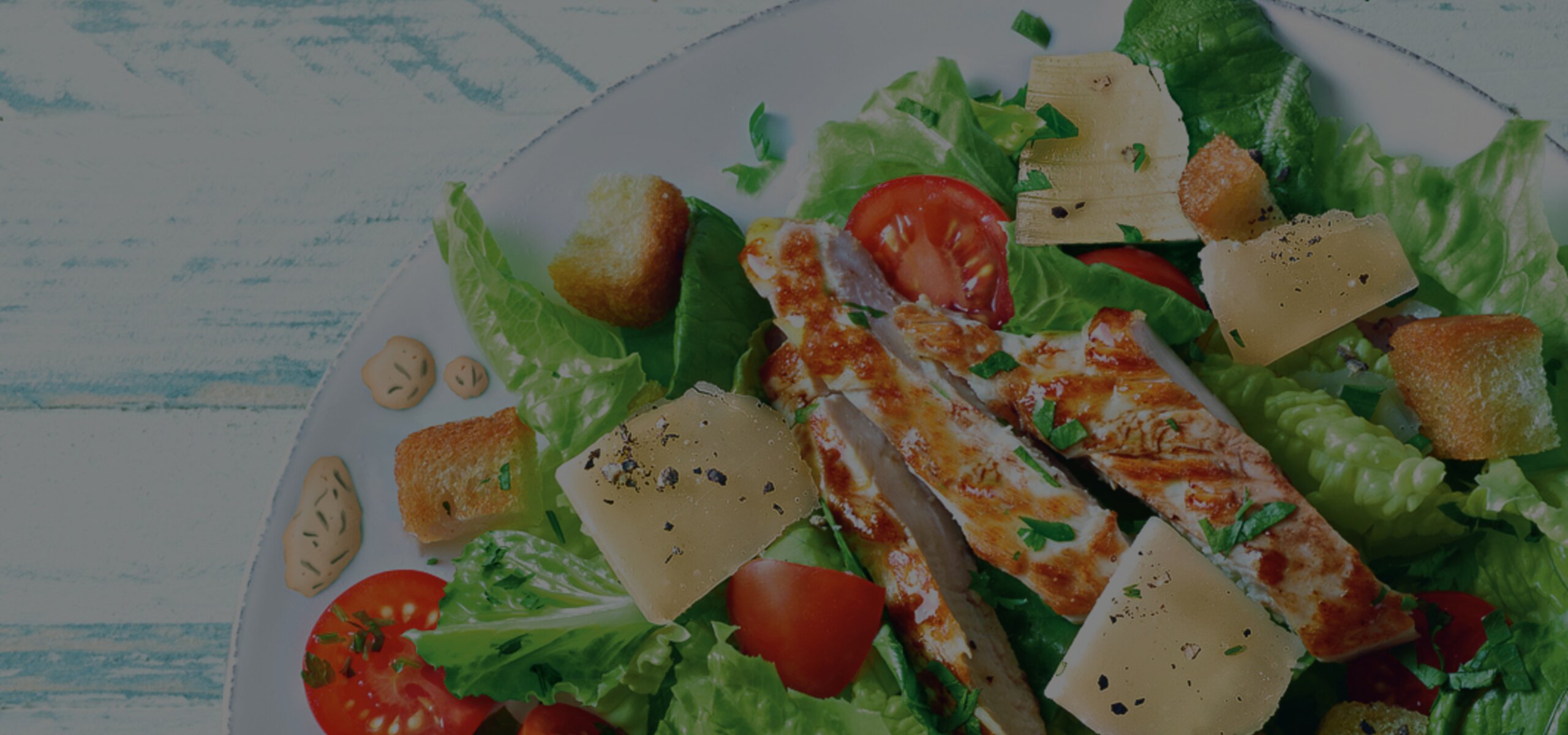 Caesar Salat als Hintergund für das French Dressing 